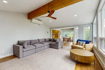 a living room with a couch and a table at Ski Dreams in Dover