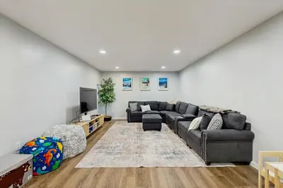 a living room with a couch and a tv at Ski Dreams in Dover