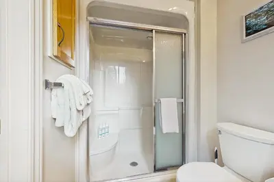 a bathroom with a shower and a toilet at Ski Dreams in Dover
