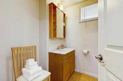 a bathroom with a sink and a toilet and a mirror at Ski Dreams in Dover