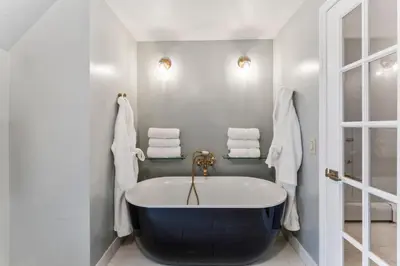 a bathroom with a large tub in a room at Lakeside Home in Brookfield