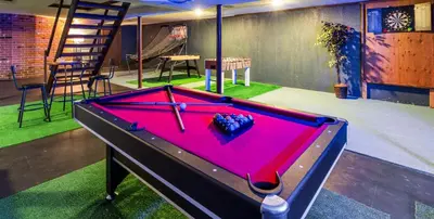 a ping pong table in a room with at Lakeside Home in Brookfield