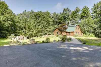 an empty driveway in front of a wooden house at 3 Mi to UMass Amherst Peaceful New England Cabin in Sunderland