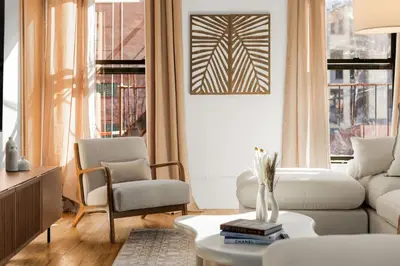 a living room with a couch and a chair at Beautifully designed 3 BDR in Dumbo NYC in Brooklyn