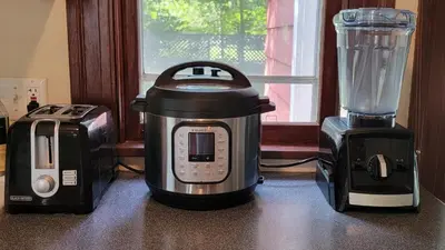 a blender and a toaster sitting next to a blender at 1920s Phoenicia Bungalow with Vintage Furnishings, Sauna, Fireplace, & Fenced Backyard in Phoenicia