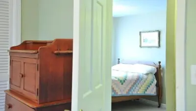 a bedroom with a bed and a wooden dresser and a dresser at Unique Ski Rental in Berkshires Charlemont Near Hawley State Forest, Plainfield, Western Massachusetts in Plainfield