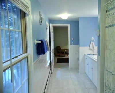 a bathroom with blue walls and a walk in shower at Unique Ski Rental in Berkshires Charlemont Near Hawley State Forest, Plainfield, Western Massachusetts in Plainfield