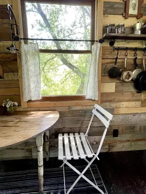 a white bench in a room with a window at Gorgeous Tiny House Rental for a Glamping Getaway near Saratoga Springs in Upstate New York in Argyle
