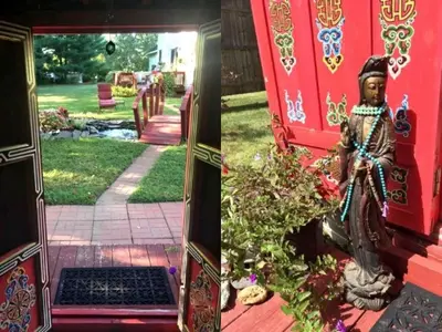 a statue sitting on the front door of a house at Authentic Mongolian Yurt for a Serene Healing Retreat in Saratoga Springs, New York in Saratoga Springs