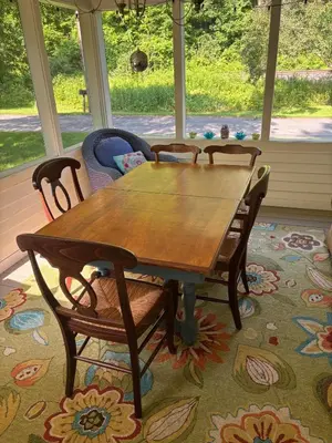 a wooden table and chairs in a room at Secluded Cabin with Gorgeous Views near Stockbridge in the Berkshires of Massachusetts in Stockbridge
