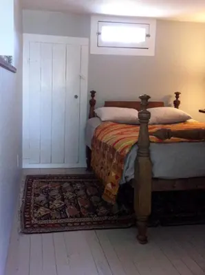 a bedroom with a bed and a window at Minimalist Countryside Villa Rental near Albany in Upstate New York in West Fulton