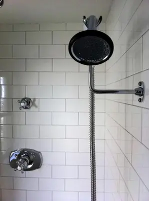 a shower with a shower head in a bathroom at Minimalist Countryside Villa Rental near Albany in Upstate New York in West Fulton