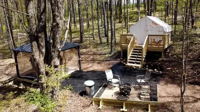 an aerial view of a tent in the woods at Luxurious Safari Tent in Cooperstown, NY - Perfect Glamping Spot for a Romantic Getaway in Cooperstown
