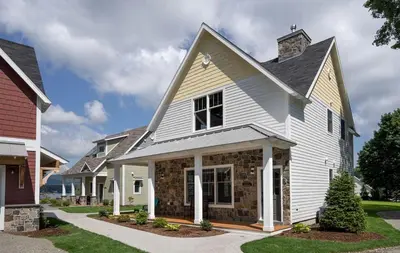 a white house with a gambrel at Beautiful Cottage Rental on Lakeside Property in Berkshires, Massachusetts in Lanesborough
