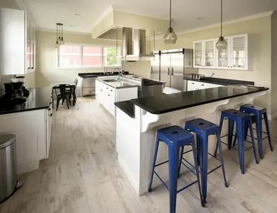 a kitchen with white cabinets and blue stools in it at Beautiful Cottage Rental on Lakeside Property in Berkshires, Massachusetts in Lanesborough