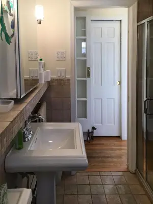 a bathroom with a sink and a mirror at Impressive Cabin with a Pool and Hot Tub Ideal for Weekend Getaways in the Catskills in Hunter