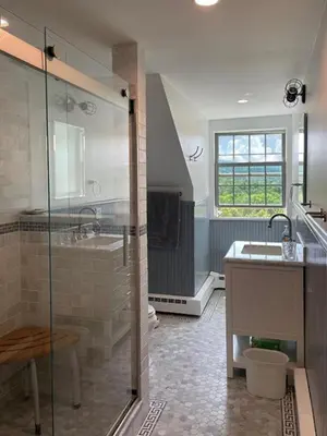 a large bathroom with a shower and a sink at Impressive Cabin with a Pool and Hot Tub Ideal for Weekend Getaways in the Catskills in Hunter