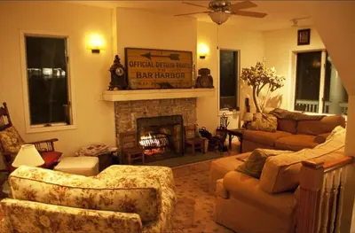 a living room with couches and a fireplace at Impressive Cabin with a Pool and Hot Tub Ideal for Weekend Getaways in the Catskills in Hunter