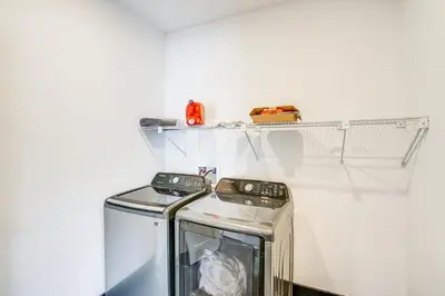 a washer and dryer sitting in a laundry room at Lux Windham Getaway - Views & Indoor Heated Pool in Windham