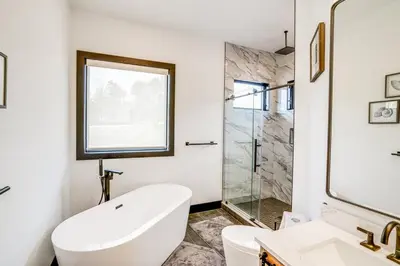 a bathroom with a toilet and a sink and a shower at Lux Windham Getaway - Views & Indoor Heated Pool in Windham