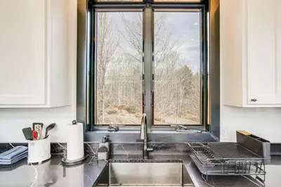 a kitchen with a sink and a window at Lux Windham Getaway - Views & Indoor Heated Pool in Windham