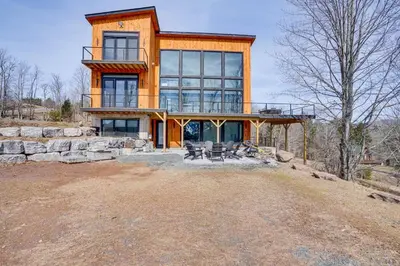 a large house on top of a hill at Lux Windham Getaway - Views & Indoor Heated Pool in Windham