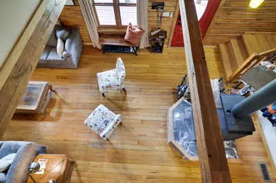 an overhead view of a living room with a couch and chairs at Secluded Escape - PAN's Wooden Casita in Lake Ariel