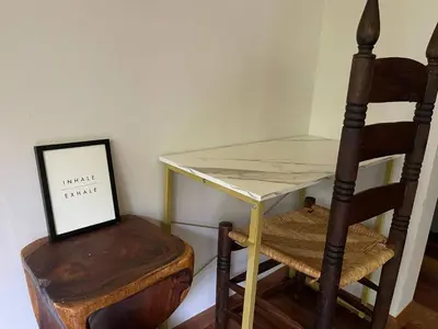 a small table and a chair next to a desk at Four Season Retreat in Heart of the Catskills in Fleischmanns
