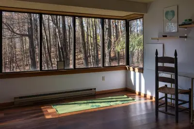 a room with a chair and a large window at Four Season Retreat in Heart of the Catskills in Fleischmanns