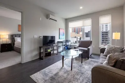 a living room with a couch and a table at Luxury Apt Downtown in White Plains