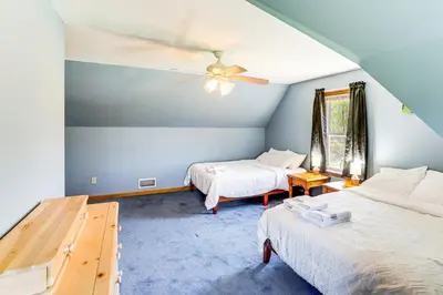 a bedroom with two beds and a ceiling fan at Mtn Views and Private Yard Retreat in Cornwallville in Cornwallville