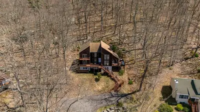 an overhead view of a house in the woods at Beautiful Modern Lodge! Game Room in Saw Creek