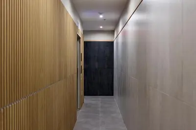 a corridor with wooden walls and a hallway with a corridorngthngthngth at Hoboken Loft Hideaway - walk to PATH in Hoboken