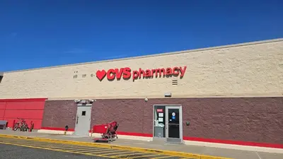 a yoshi pharmacy sign on the side of a building at The Heart of Hicksville House in Hicksville