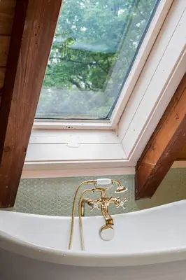 a bathroom with a sink with a window at Catskill Estate epic views hot tub in Kingston
