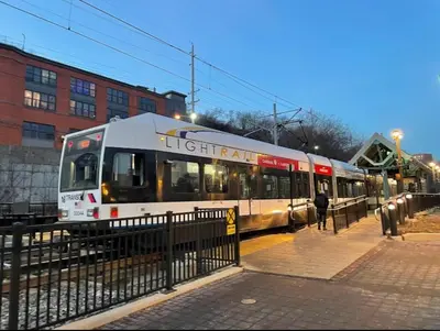 a train on the tracks in a city at City Escape with 2 Baths, 10 beds and We Pay Half Parking for 2 cars, NYC in 15 min in Hoboken