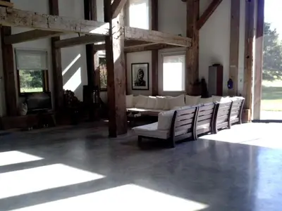 a living room with white chairs and a couch at Boutique Barn Vacation Rental in Hudson Valley and Two Hours from New York City in Saugerties