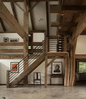 a staircase in a loft with a picture of a man at Boutique Barn Vacation Rental in Hudson Valley and Two Hours from New York City in Saugerties