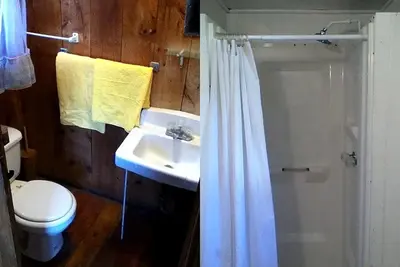 a bathroom with a sink and a toilet and a shower at Cozy Cabin with Lovely Views of Great Sacandaga Lake in Northville, New York in Northville
