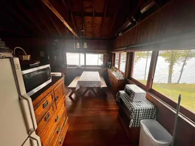 an inside view of an rv with a table in it at Cozy Cabin with Lovely Views of Great Sacandaga Lake in Northville, New York in Northville