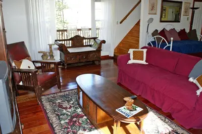 a living room with a red couch and chairs at Romantic Cottage Rental with Hot Tub Outside Woodstock, New York in Bearsville