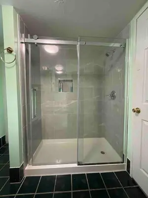 a shower with a glass door in a bathroom at Romantic Cottage Rental with Hot Tub Outside Woodstock, New York in Bearsville