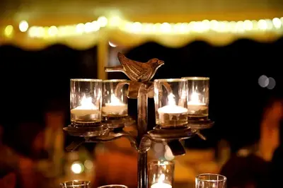 a candle holder with a bird sitting on top of it at Secluded Cottage Rental with a Heated Pool in Red Hook for Family Getaways in New York State in Red Hook