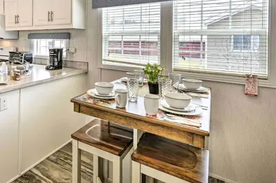 a kitchen with a table with dishes on it at Great Vacation Complex for the Best Pennsylvania Glamping in Scranton