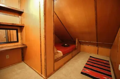 a small room with a bunk bed and a mirror at Fantastic Secluded Rental for a Large Group Getaway near East Branch, New York in Fishs Eddy