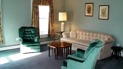 a living room with a couch and two chairs at Hilltop Cottage Rental Overlooking Creek near Albany in Upstate New York in Fly Creek