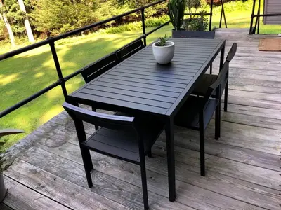 a wooden table with a potted plant on a deck at Stunning A-Frame Cabin Rental in the Catskills near Albany, New York in Kingston