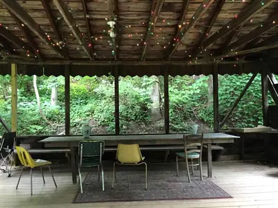a table and chairs in a pavilion with trees at Rustic Couples' Cabin for Idyllic Catskills Getaway, Upstate New York in Shandaken