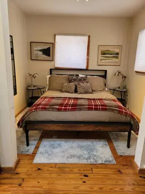 a bedroom with a large bed in a room at Romantic Mountain Cabin with Stunning Views in Ulster County, New York in Shandaken