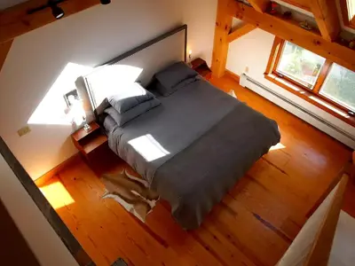 an overhead view of a bedroom with a large bed at Modern and Family-Friendly Vacation Rental in the Berkshires near Great Barrington in Monterey